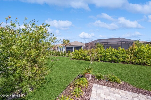 view of yard featuring a lanai