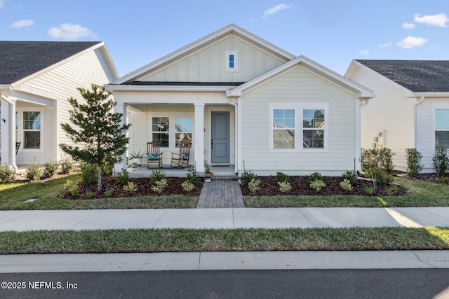 view of front of home featuring board and batten siding and covered porch