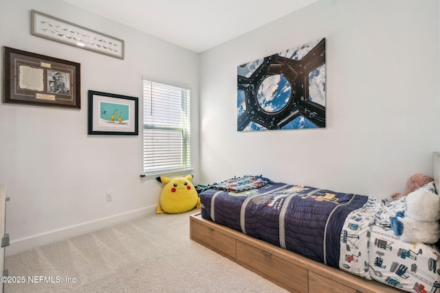 carpeted bedroom featuring baseboards