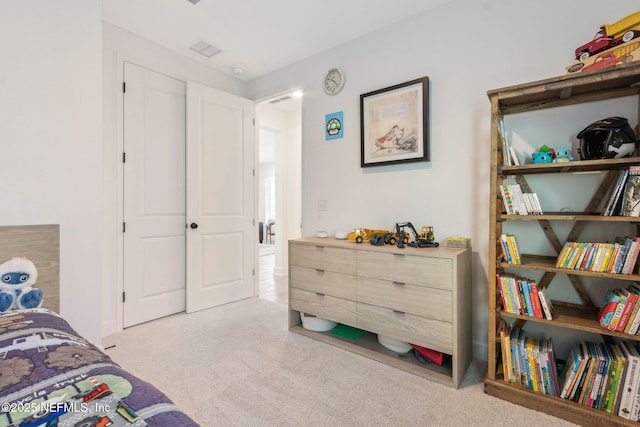 bedroom with carpet flooring and visible vents