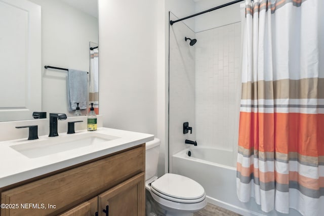 bathroom with toilet, shower / tub combo, and vanity