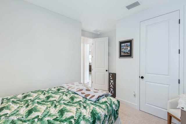 bedroom featuring baseboards, visible vents, and carpet flooring