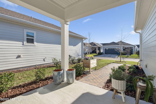 view of patio / terrace with an outbuilding