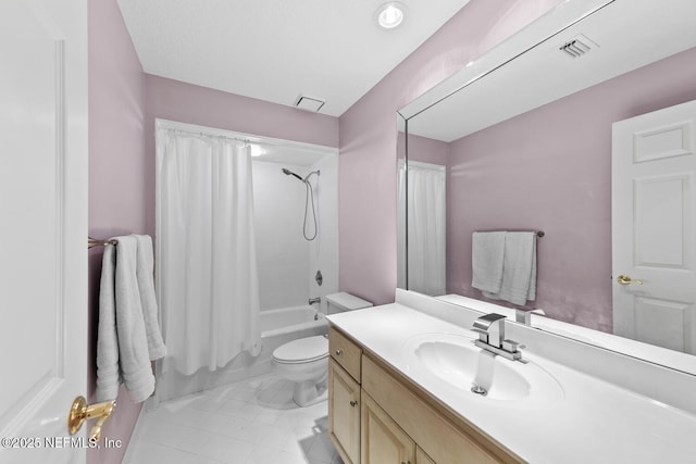 bathroom with visible vents, toilet, vanity, and shower / bath combo