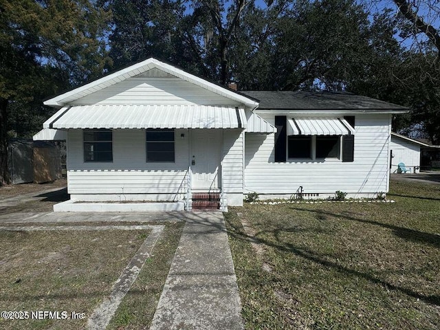 bungalow with a front yard