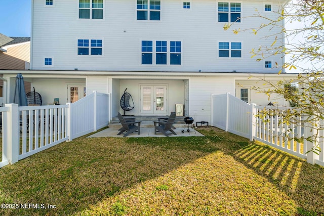 2072 Gail Ave, Jacksonville Beach, FL 32250 - rear view of property featuring a yard, a fenced backyard, entry steps, and a patio