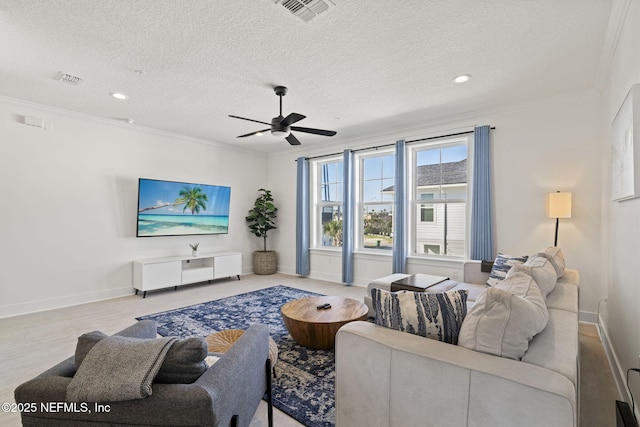 2072 Gail Ave, Jacksonville Beach, FL 32250 - living area with visible vents, a textured ceiling, and ornamental molding