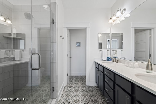 2072 Gail Ave, Jacksonville Beach, FL 32250 - full bath with double vanity, a stall shower, a sink, and tile patterned flooring