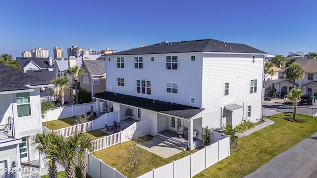 2072 Gail Ave, Jacksonville Beach, FL 32250 - exterior space with a yard, a patio, a residential view, and a fenced backyard