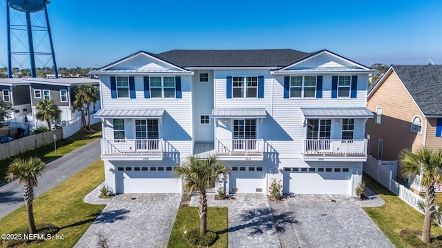 2072 Gail Ave, Jacksonville Beach, FL 32250 - raised beach house with a standing seam roof, an attached garage, driveway, and metal roof