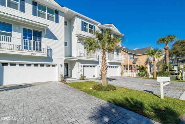 2072 Gail Ave, Jacksonville Beach, FL 32250 - view of front facade with decorative driveway, a residential view, and an attached garage