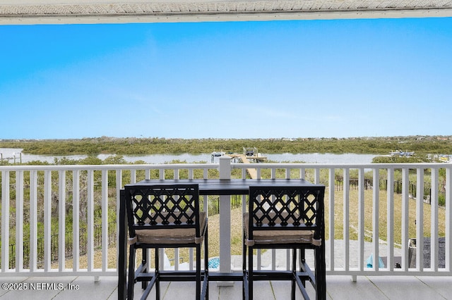 balcony featuring a water view