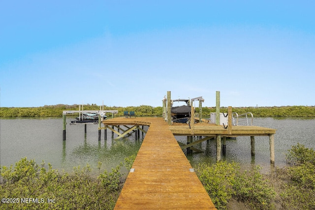 view of dock with a water view and boat lift