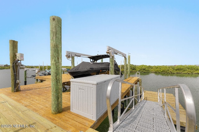 dock area featuring a water view and boat lift