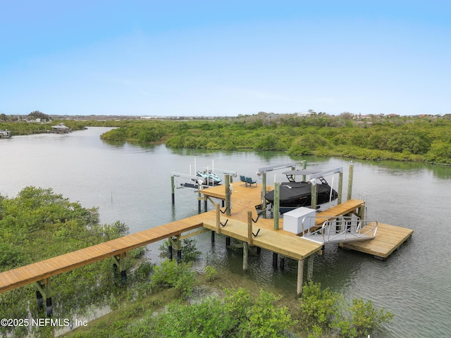 367 Five Island Dr, Saint Augustine, FL 32080 - view of dock featuring boat lift and a water view