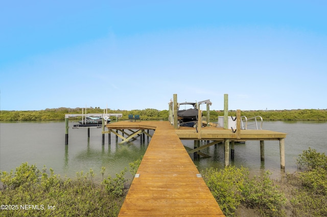 367 Five Island Dr, Saint Augustine, FL 32080 - dock area featuring boat lift and a water view