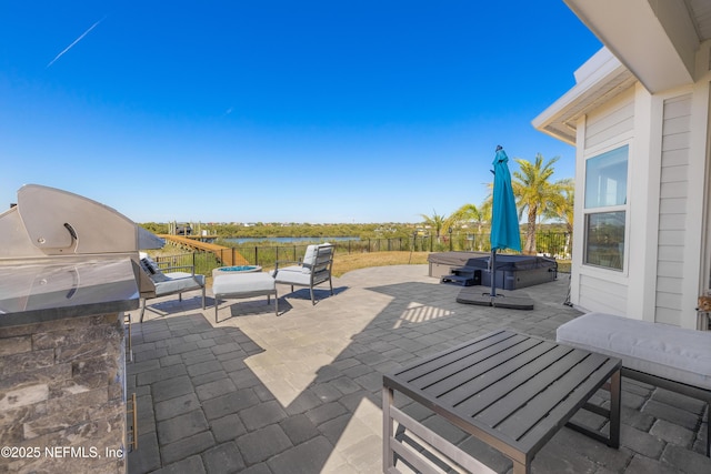 367 Five Island Dr, Saint Augustine, FL 32080 - view of patio with area for grilling, a fenced backyard, a grill, and a hot tub