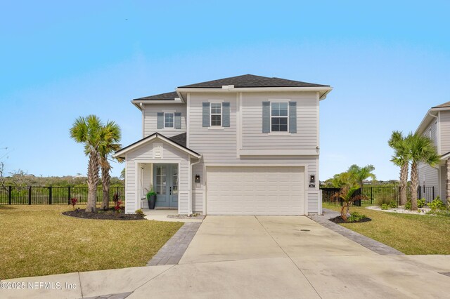 367 Five Island Dr, Saint Augustine, FL 32080 - view of front of home with a front yard, fence, a garage, and driveway