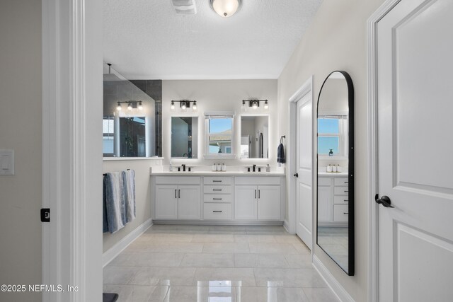 367 Five Island Dr, Saint Augustine, FL 32080 - full bathroom with a textured ceiling, double vanity, and a sink