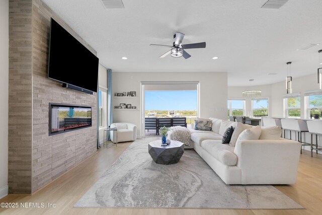 367 Five Island Dr, Saint Augustine, FL 32080 - living area with light wood finished floors, visible vents, and a ceiling fan