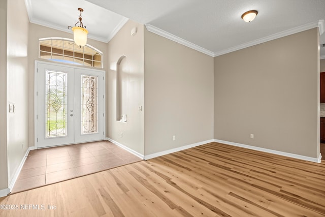 244 Palazzo Cir, Saint Augustine, FL 32092 - foyer with french doors, crown molding, wood finished floors, baseboards, and arched walkways