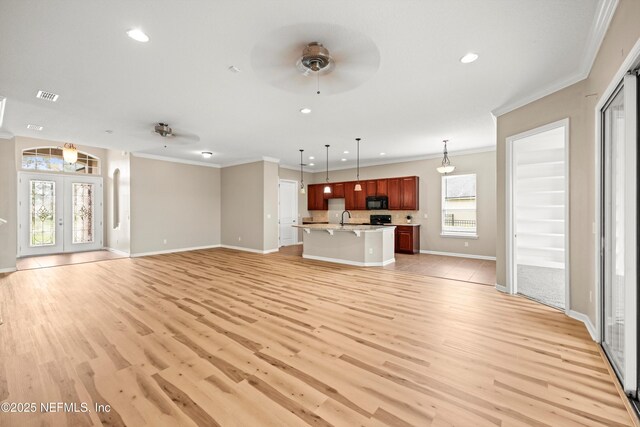 244 Palazzo Cir, Saint Augustine, FL 32092 - unfurnished living room with ceiling fan, crown molding, a sink, light wood-style flooring, and baseboards