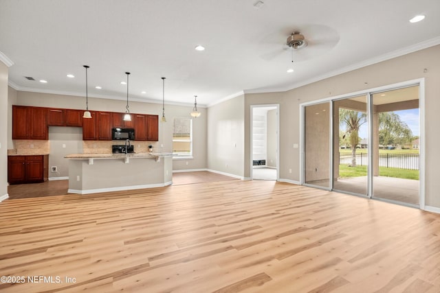 244 Palazzo Cir, Saint Augustine, FL 32092 - kitchen featuring black microwave, recessed lighting, a ceiling fan, decorative backsplash, and baseboards