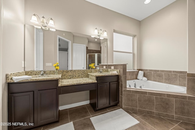244 Palazzo Cir, Saint Augustine, FL 32092 - bathroom with tile patterned floors, double vanity, a shower stall, and a garden tub