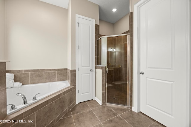 244 Palazzo Cir, Saint Augustine, FL 32092 - bathroom with a garden tub, a shower stall, and tile patterned flooring