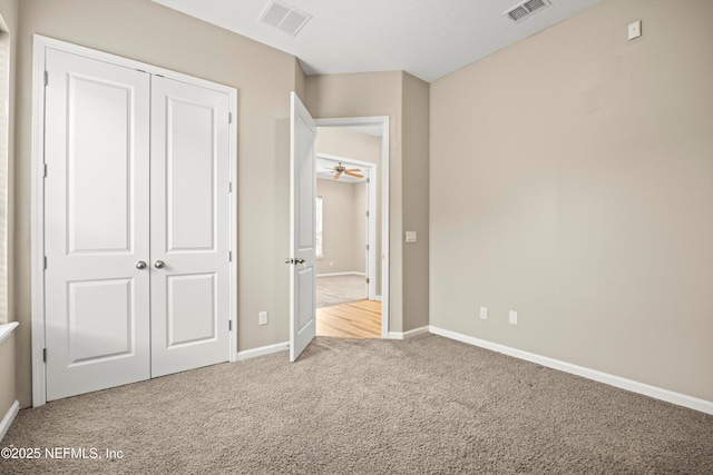 244 Palazzo Cir, Saint Augustine, FL 32092 - unfurnished bedroom featuring carpet flooring, baseboards, and a closet
