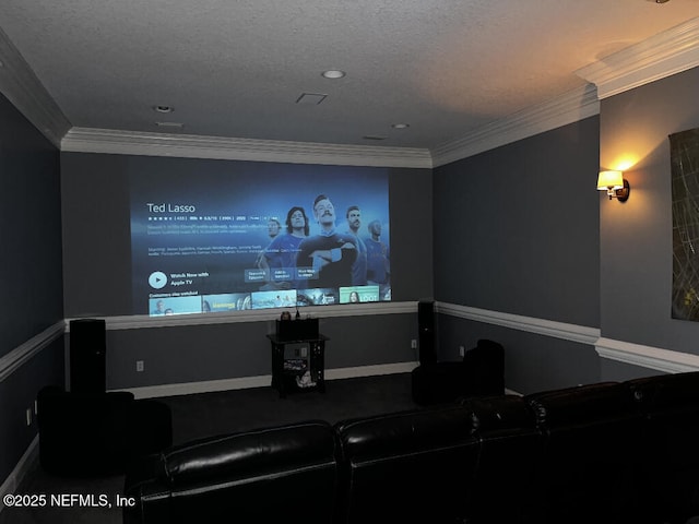 home theater room featuring a textured ceiling and ornamental molding