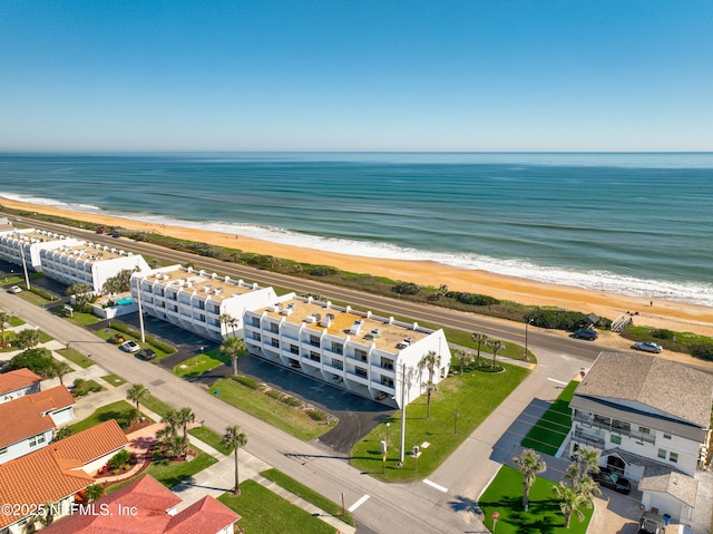 birds eye view of property featuring a view of the beach and a water view