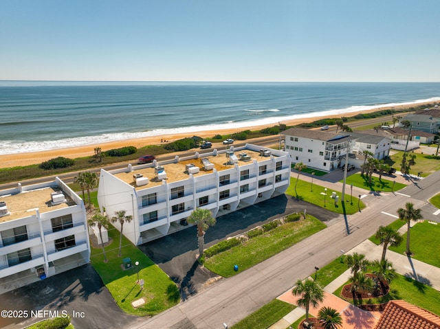 bird's eye view with a beach view and a water view