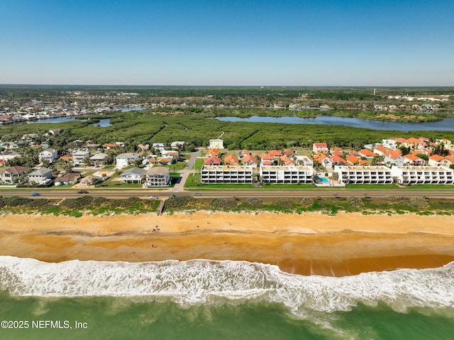 aerial view featuring a water view and a view of the beach