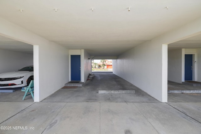 view of vehicle parking featuring a parking deck