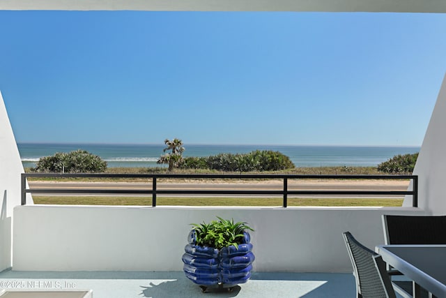 balcony featuring a water view