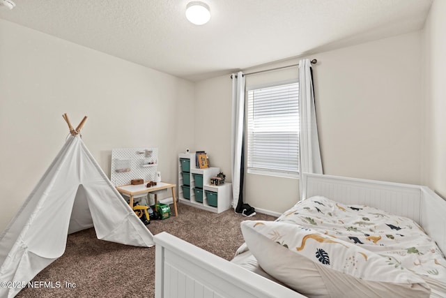 carpeted bedroom with a textured ceiling