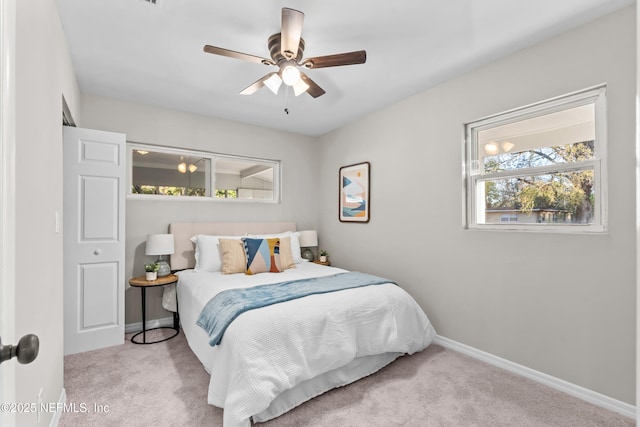 bedroom with carpet, ceiling fan, and baseboards