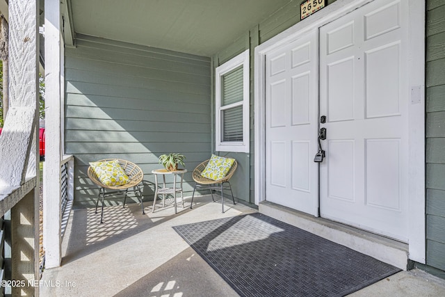 doorway to property with a porch