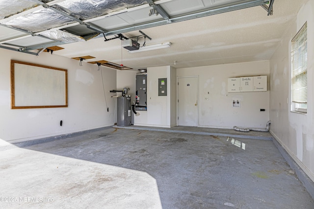 garage featuring electric panel, electric water heater, and a garage door opener