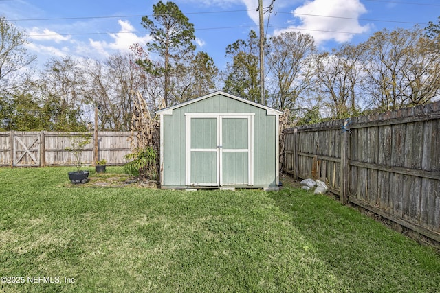 view of shed with a fenced backyard