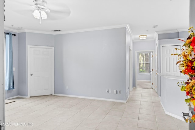 empty room featuring light tile patterned floors, ceiling fan, baseboards, and ornamental molding