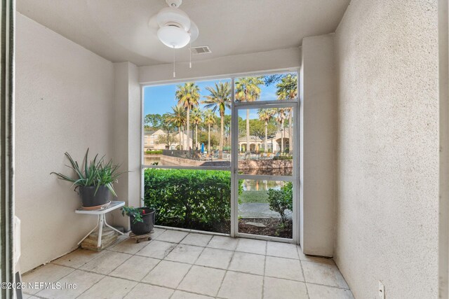 unfurnished sunroom with visible vents