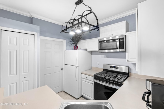 kitchen featuring white cabinetry, crown molding, light countertops, and stainless steel appliances