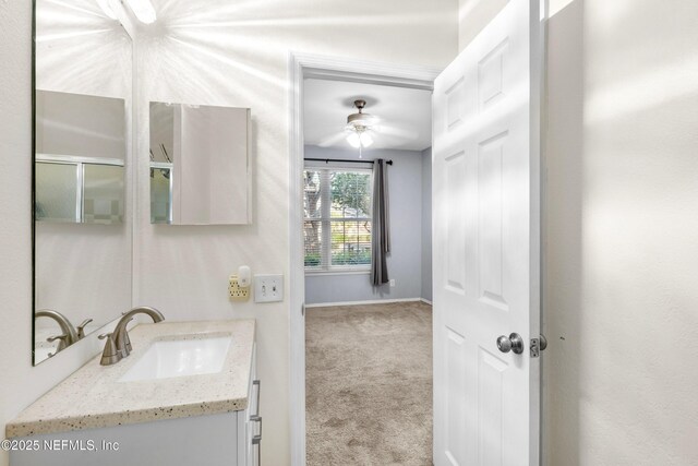 bathroom featuring vanity and baseboards