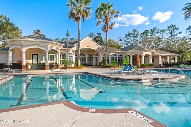 community pool with a patio