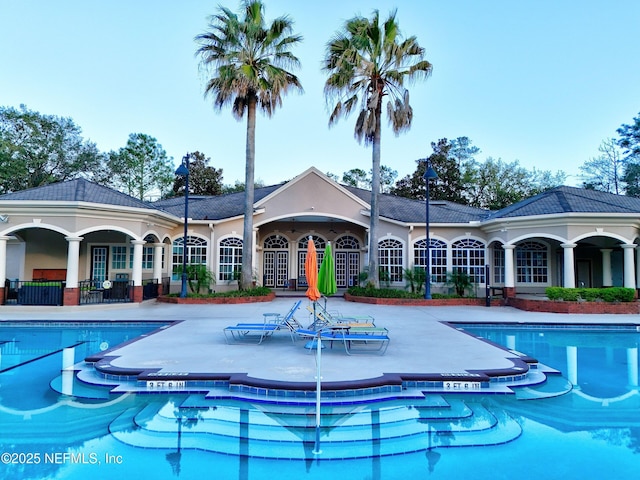 pool with a patio