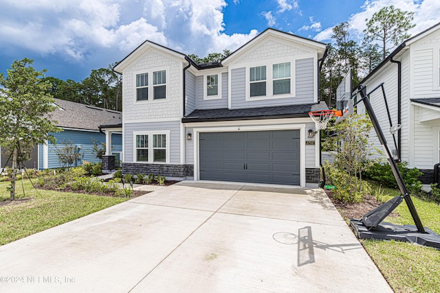 craftsman house with stone siding, an attached garage, and concrete driveway