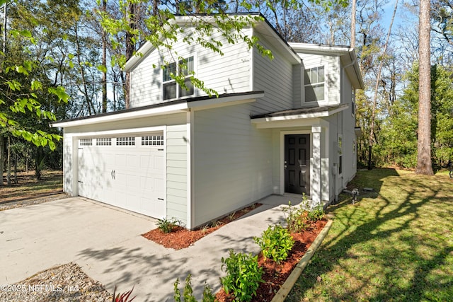 traditional-style home with a front lawn and a garage