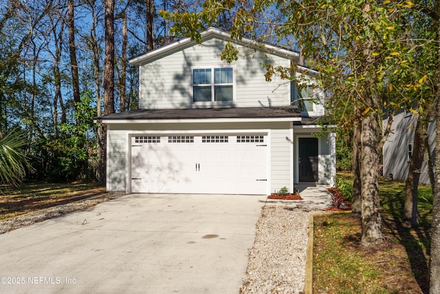 traditional-style house with concrete driveway